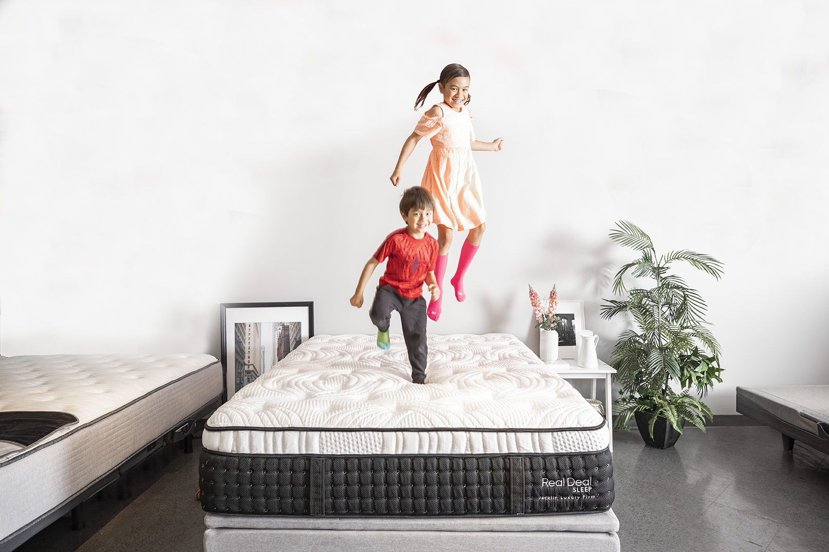 Children jumping on Jacklin Model Bed